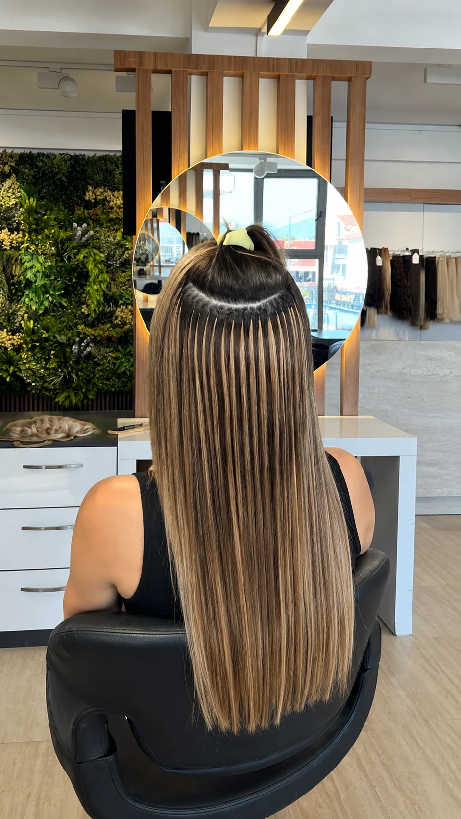 Close-up of discreet keratin fusion bonds attached to carefully sectioned natural hair